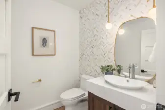Main floor powder room. Sorry, the mirror was not hung at the time of photo shoot. Happening soon :)