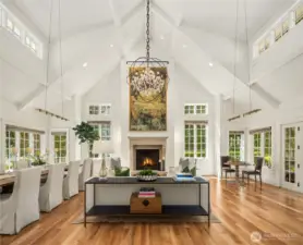 Striking great room boasts a 20+ foot vaulted ceiling with dormered windows