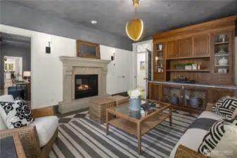 Garden room with Francoise and Company fireplace surrounded by Bedrosian’s tile