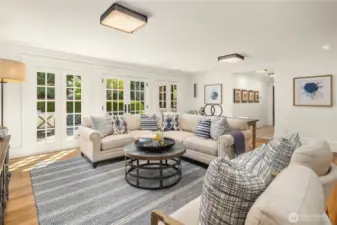 French doors from all rooms lead to out to the rear patio and garden