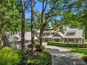 A circular driveway and 3 car detached garage round out this elegant estate