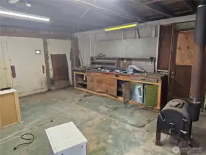 Woodstove and workbenches in the garage