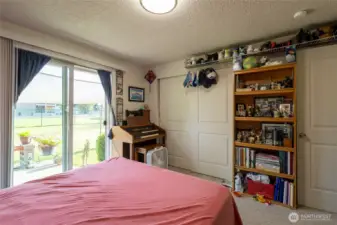 Bedroom 1 with sliding door out to the patio