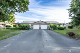 Each unit offers 1 car garage with extra storage. Unit 107 on the left is vacant.
