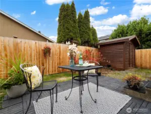 The back yard offers privacy and holds a nice shed for your tools and toys.