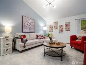 Curl up with a good book or have lively conversations with friends in this spacious living room.