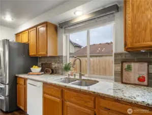 The dishes will be well lit in this kitchen. The large window let's in so much natural light.