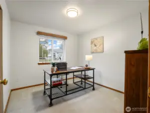 The second bedroom, here staged as an office, is the smallest of the two bedrooms but still offers plenty of room.