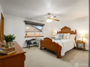 The primary bedroom is large in size and is here holding a king size bed with plenty of room to spare.