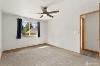 Another view of primary bedroom