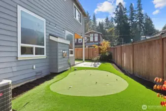 Putting green along back of house.