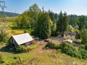Barn, old outbuildings and house.