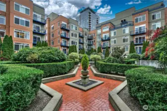 A lush courtyard connects the buildings and offers greenspace and calm in the mmiddle of the city