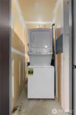 Private laundry just outside front door in utility closet