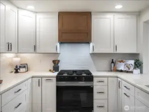 Kitchen cabinets, stove and hoodvent