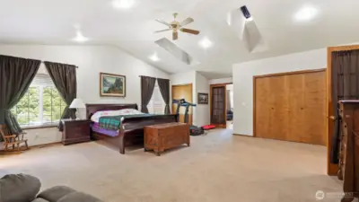 Huge primary bedroom with 2 closets and vaulted ceilings