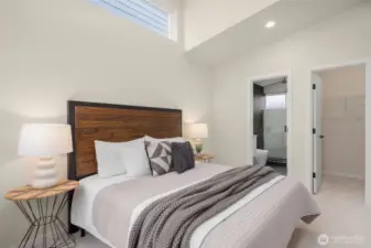 Serene primary suite with vaulted ceilings and ensuite bath — the perfect blend of luxury and comfort.