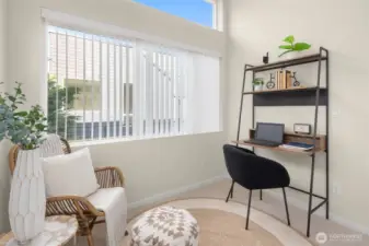 Flexible upper-level room — ideal as a reading nook, home office, or creative studio space flooded with natural light.