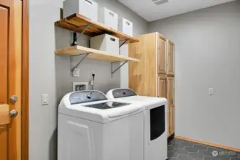 Handy utility room with storage.