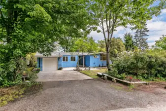 This Meadowbrook home is located close to freeway access, shopping, parks, schools and more but you can't tell when you arrive in this well-treed and private setting.