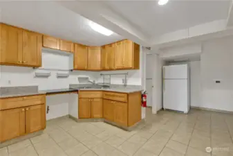 Lower level kitchenette with sink and gas supply line.