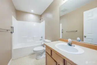 On the second level, turning right, you will find a full bath for guests and family.