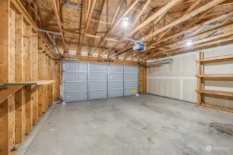 Extra shelving in the garage ensures generous storage space.