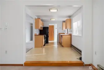 Looking from the family room toward the dining room and kitchen. The living room is to the left.