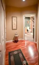 Hallway w/Laundry and furnace on left, bathroom entrance