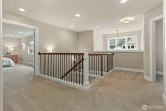 Upstairs is large and has 4 generously sized bedrooms including the primary suite (shown to the left), an additional bathroom and a conveniently located washer/dryer room.