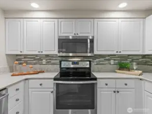 Kitchen offers lots of cabinets, stainless steel appliances and pantry closet.