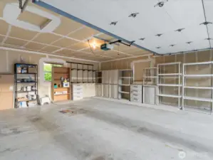 This unit also features a private large 2-car garage, including storage shelves.