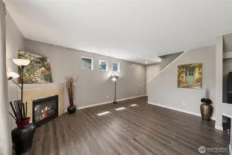 A spacious Great Room with a cozy Fireplace