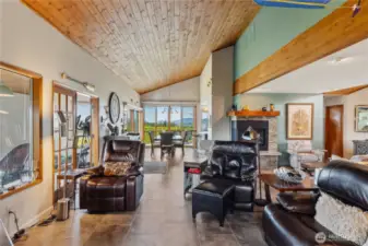 Living, dining and sunroom with beautiful wood ceilings, new windows and decks.