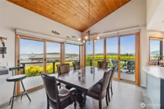 Entertain dinner guests in this generous dining space with walls of windows and leads to the deck for indoor/outdoor use.