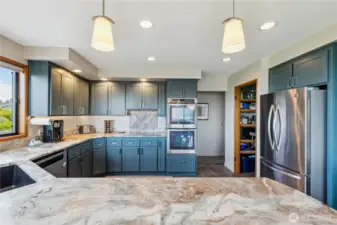 Gorgeous chef's kitchen with leathered granite counters, freshly painted cabinets, stainless appliances, a walk-in pantry for additional storage. There's even a coffee bar to the right (not shown). Enjoy the view as you wash the dishes!!