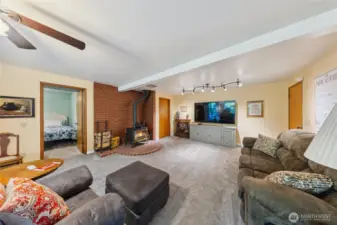 Downstairs offers a spacious family room, 2 bedrooms and a bathroom plus a mud room.