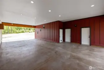 The 960 sq. ft. carport is built for durability and versatility, featuring a custom 4" concrete slab with six-sack mix and Propex fibers. A 50-amp plug offers power for welding, an RV, or even a sauna. The first door on the left leads to the water filtration room, which houses a newer filtration system and water softener. The private well is also equipped with a recently installed pump, ensuring reliable water access.