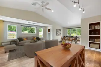 Enjoy open-concept living with a seamless flow between the kitchen, dining, and living areas. Vaulted ceilings and large windows fill the space with natural light while showcasing stunning territorial views.