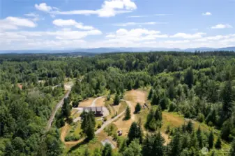 The previous owner prepared a separate building site, offering potential for a second home. Just to the right, you'll find a custom-built chicken coop and a storage shed. Additionally, a 40-foot shipping container on the property provides ample extra storage for tools, equipment, or seasonal items.