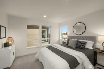 This secondary bedroom is bathed in natural light, creating a serene and welcoming atmosphere. Its neutral tones and spacious layout make it a perfect space to unwind after a busy day. Photos of home with similar layout, finishes & fixtures.