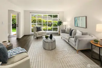 Expansive south-facing bay window fills the space with warm natural light.