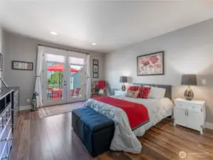 Primary bedroom with french doors to rear patio