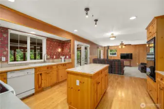 A well appointed kitchen which includes multiple sink/counter spaces