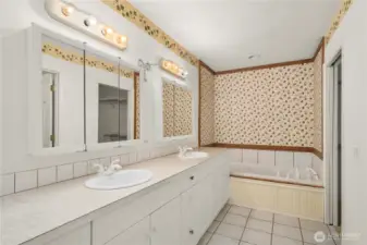 Main floor attached primary bathroom with whirlpool tub & seperate shower