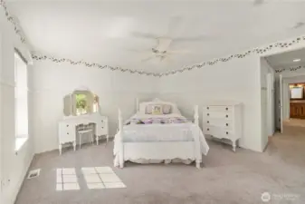Main floor primary bedroom with attached bathroom & closet