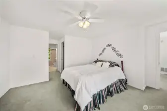Upper primary bedroom with attached bathroom/closet