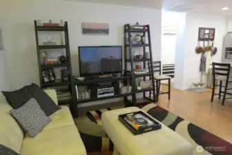 Living room toward kitchen and hall to bath and bedrooms.  This small home lives big!  New floors throughout.
