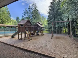 swing set and pay area outside clubhouse.