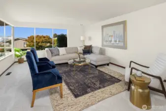 One of three living spaces with lots of windows and light.